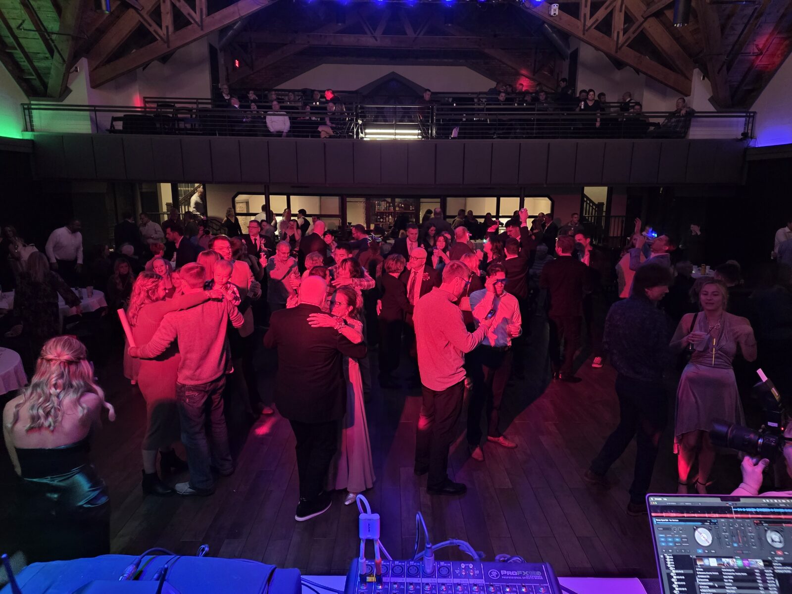 A packed dance floor at a Fargo wedding lit by Midnight Express DJs